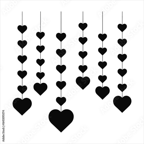 Decorative hanging black hearts on white background symbolizing love and romance