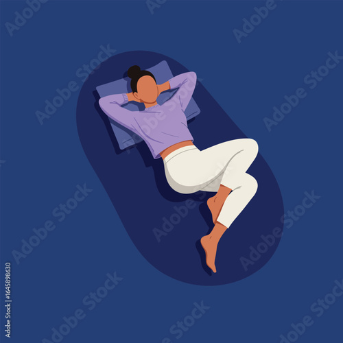 A woman lying down on a mat, resting comfortably with her hands behind her head, enjoying a moment of peace and relaxation in a serene setting