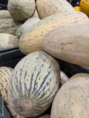 big melons on the counter in the store background