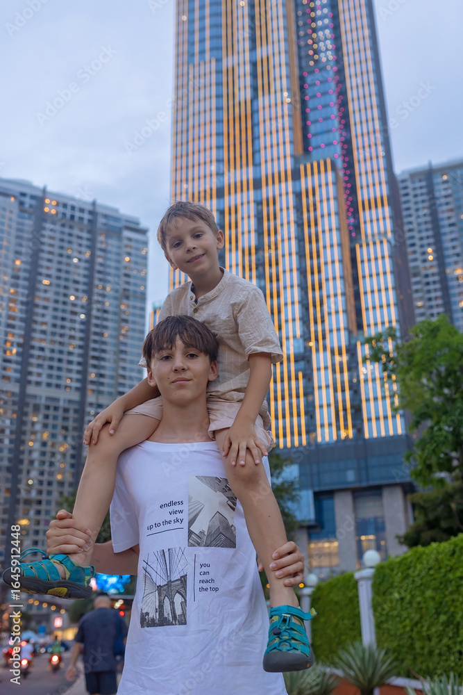 Fototapeta premium Family with children, boys, visiting Ho Chi Minh city, Saigon, fot a holiday, enjoying asian culture