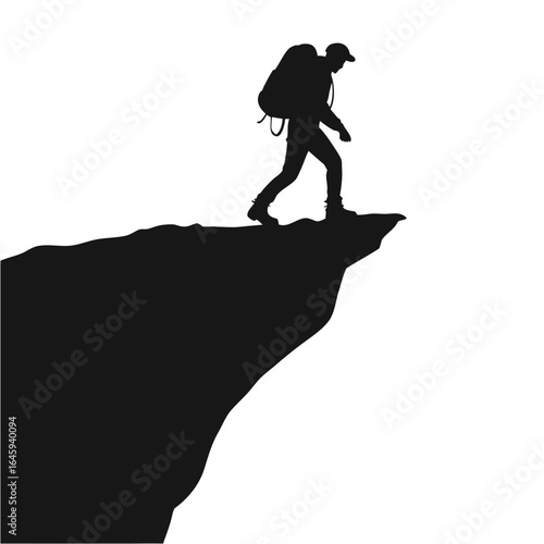 Hiker on cliff edge silhouette