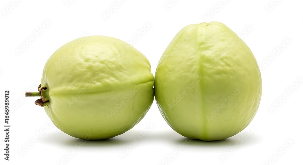 Fototapeta premium Two ripe green guavas on a white background