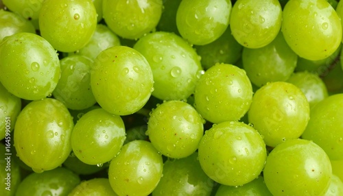 Close-up of glossy green grape cluster with dense, vibrant texture