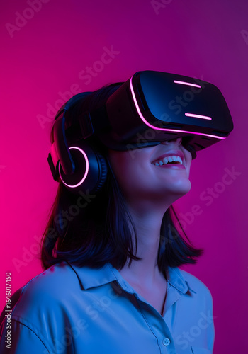 Woman smiling while wearing VR headset with pink and blue lighting virtual reality