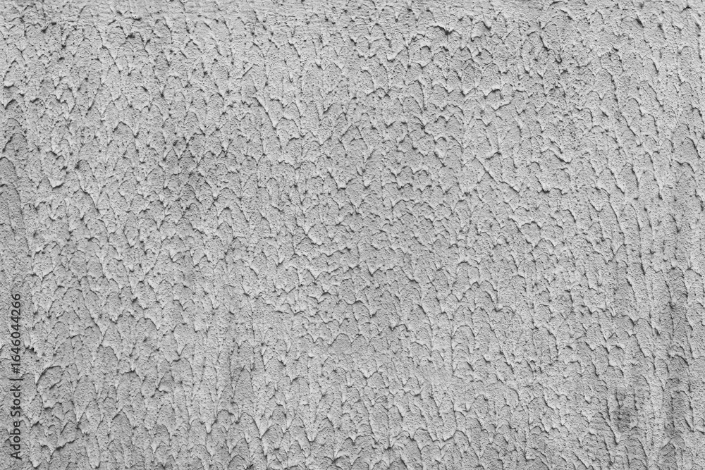 Obraz premium Uneven, old plaster on a concrete wall.