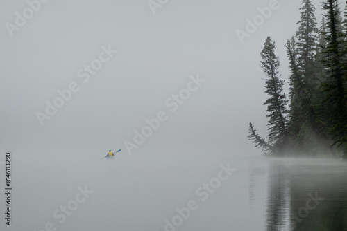 kayaker in early morning fog