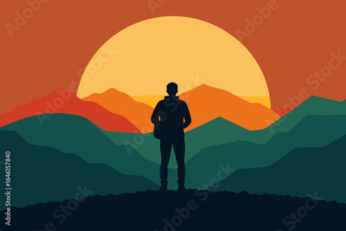 Silhouette of a hiker overlooking mountains at sunset