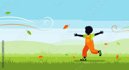 Silhouette of a boy running through a windy field enjoying the autumn season breeze