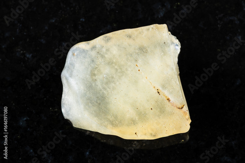 sample of rough libyan desert glass on black