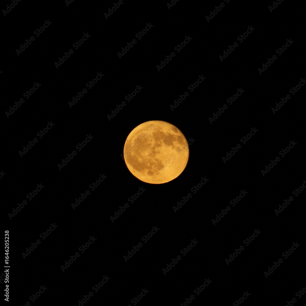 Obraz premium Orange moon over Bowman Gray Stadium