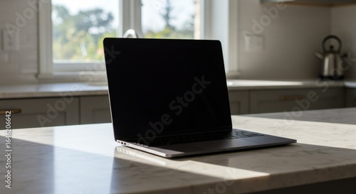 Wallpaper Mural Laptop with Blank Screen on a Sunny Kitchen Counter Torontodigital.ca