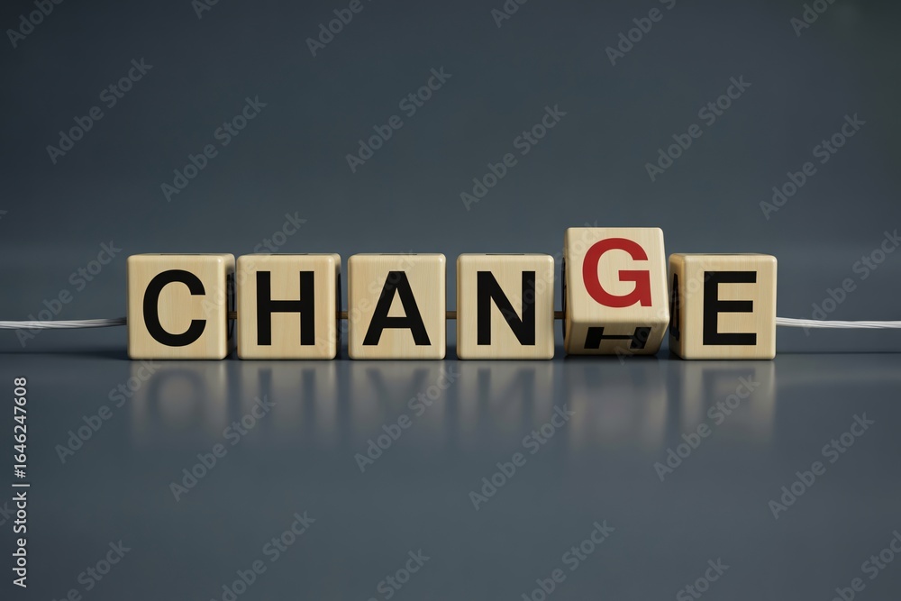 Obraz premium Wooden cube flipping from word change to chance on blue table concept for opportunity and transformation.