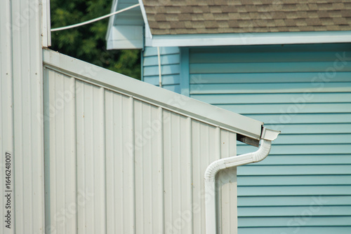 gutters and drain pipe on a steel building