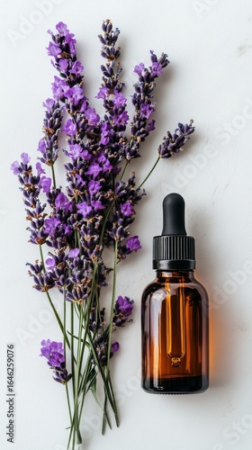 Lavender Flowers and Essential Oil Bottle on White Background Showcasing Arom...