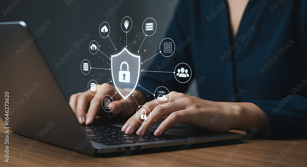 Naklejka premium Woman typing on laptop with cybersecurity shield and padlock icon for data protection, internet security, and network safety in the digital world for business and privacy
