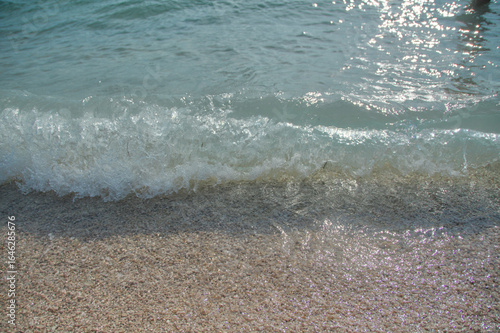 Fototapeta Naklejka Na Ścianę i Meble -  Adriatic sea surf water wave on pebble beach in Croatia