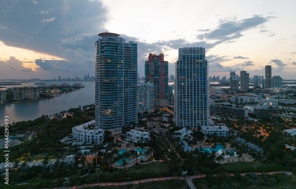 Obraz premium Top view of South Miami Beach and the ocean. Miami skyline with skyscrapers. Aerial view of Miami in summer. Miami shore with luxury buildings. Scenic drone view of Miamis famous coastline.