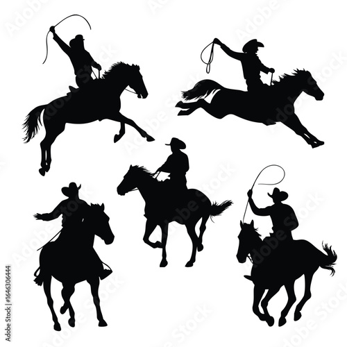 Silhouettes of cowboys on horseback with lassos