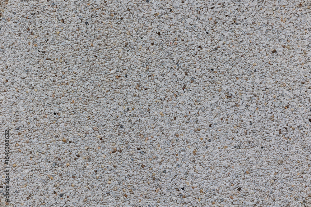 Close-up photograph of a rough granite wall, showcasing textured stone blocks with natural color variations in brown, gray, and sand tones, emphasizing the rugged, weathered surface Close-up photograph of a rough granite wall, showcasing textured stone blocks with natural color variations in brown, gray, and sand tones, emphasizing the rugged, weathered surface