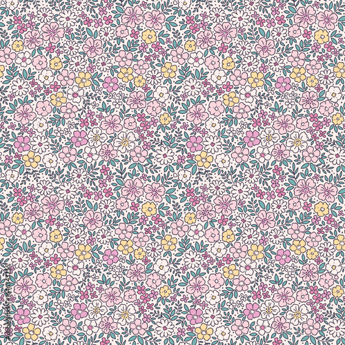 Vintage seamless floral pattern. Liberty style background of small pastel yellow and pink flowers. Small flowers scattered over a ivory background. Stock vector for printing on surfaces. Ditsy flowers