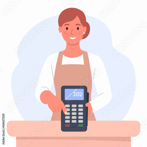 Smiling female cashier in a beige apron entering an amount on a POS terminal.