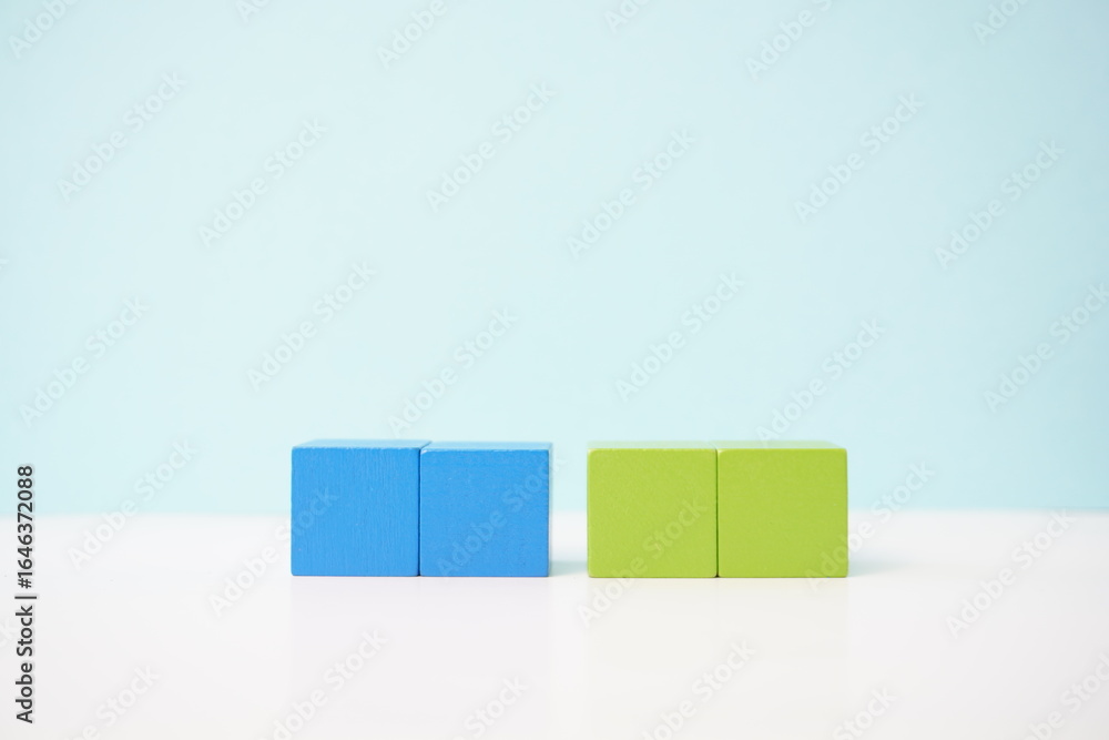 Obraz premium Colorful wooden blocks symbolizing concepts of balance and teamwork. strategy, business, economy and educational concepts