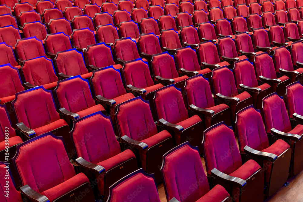 Fototapeta premium Empty theater red seats - stock photo