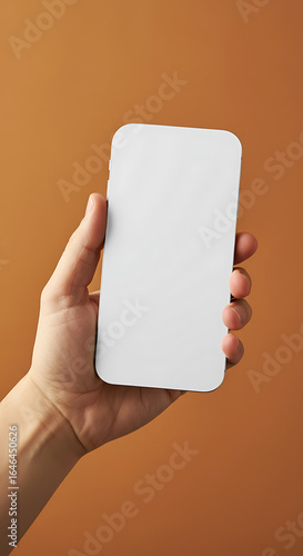 Hand holding a blank white smartphone.
