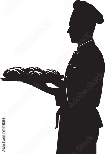 Baker Silhouette Holding Fresh Baked Bread on Tray