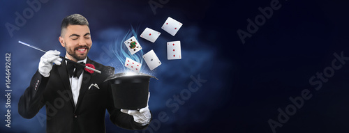 Foto Male magician showing tricks with hat on white background