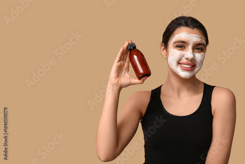 Happy young woman with faci...