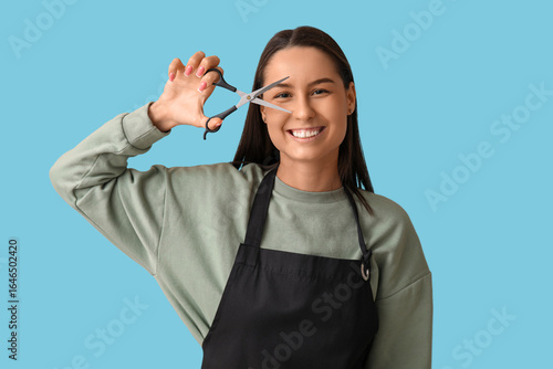 Female hairdresser with sci...