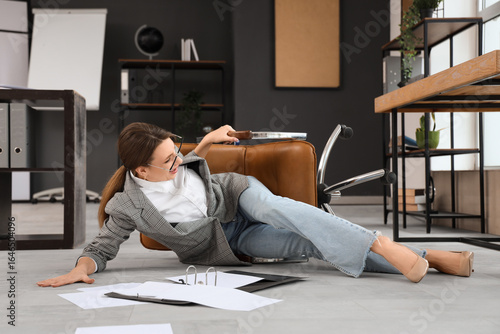 Young businesswoman fell do...