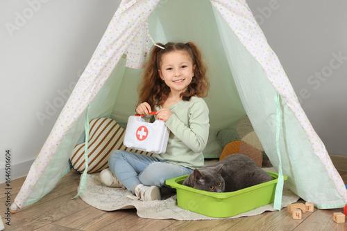 Cute little girl with first...