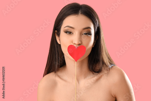 Beautiful young woman kissi...