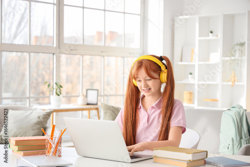 Cute ginger girl with books...