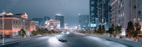 Racing car speeds down a city street at twilight with skyscrapers glowing in the background