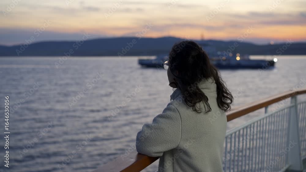 Woman tourist on a ferry boat in 1915 Cannakale bridge in Turkey at sunset Woman tourist on a ferry boat in 1915 Cannakale bridge in Turkey at sunset