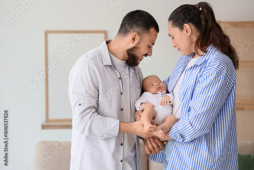 Young parents with their li...