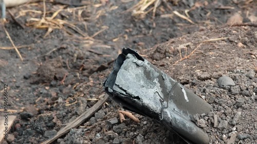 Wallpaper Mural Smoke rises from burning material inside a rustic kiln used for traditional charcoal production Torontodigital.ca