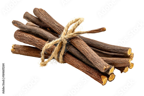 Licorice root sticks tied with twine dark background