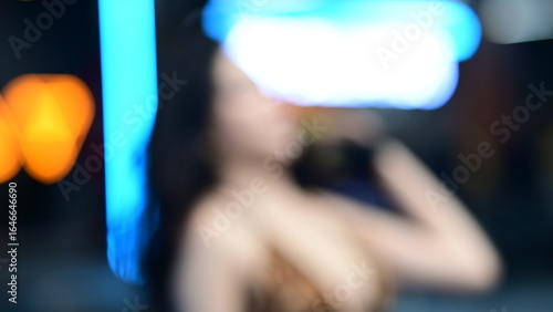 Defocused Artistic Photo with Orange and Blue Neon Bokeh