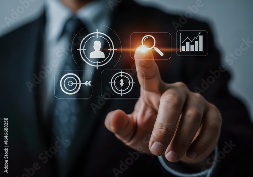 Businessman touching a digital interface with business analytics and strategy icons