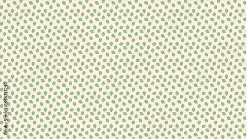 A beautiful composition of tropical leaves in understated, muted green colors, artfully arranged on a neutral beige or cream background for a touch of elegance.