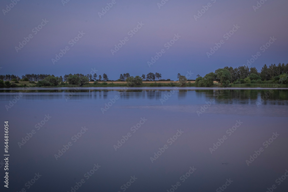 Fototapeta premium A lovely evening on the pond after sunset