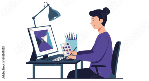 Designer working at desk with digital art on computer screen