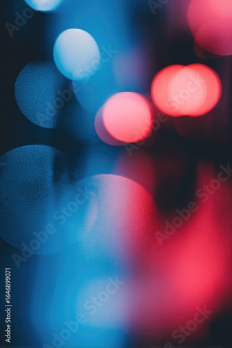 Abstract bokeh of vibrant blue and red lights