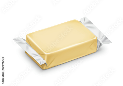 A wrapped rectangular block of butter with foil sticking out from the sides