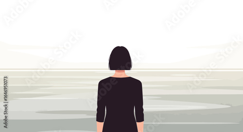 Young woman standing alone contemplating vast open space and distant horizon concept