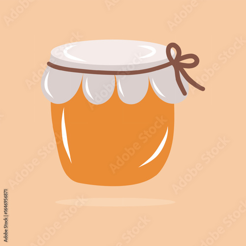 A jar of pumpkin jam isolated on an orange background.